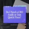 A person in a black blazer holds a purple folder titled “Do I Need a CRO Audit or Just Quick Fixes?” featuring the URL PENGUINDESIGNING.COM.